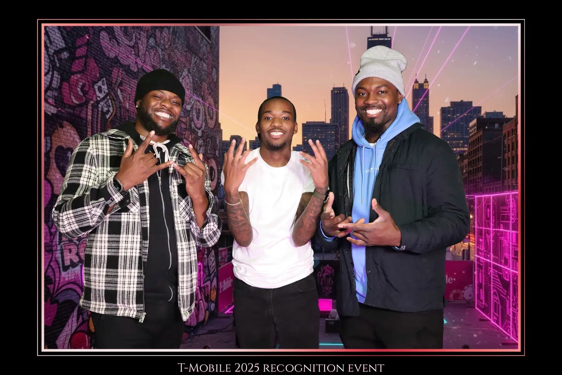 Three guests photographed against a custom Chicago event backdrop by Images & Creations