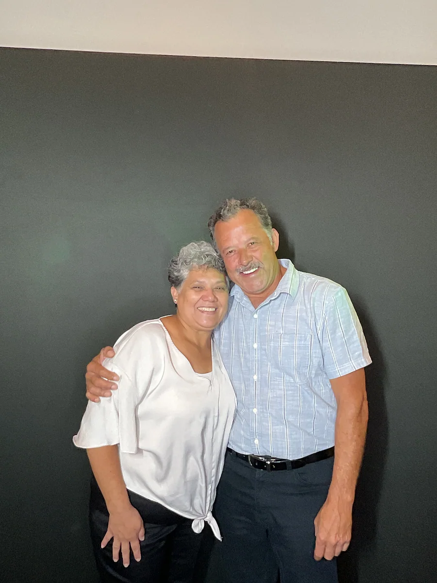 Two guests smiling together at a 50th birthday celebration by Images & Creations