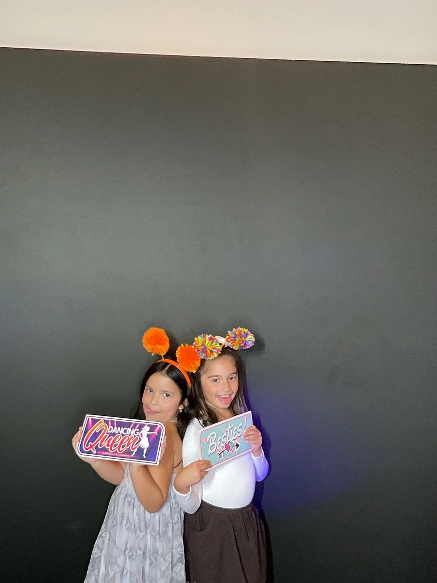Young guests posing with bright party props at Rosa’s birthday by Images & Creations