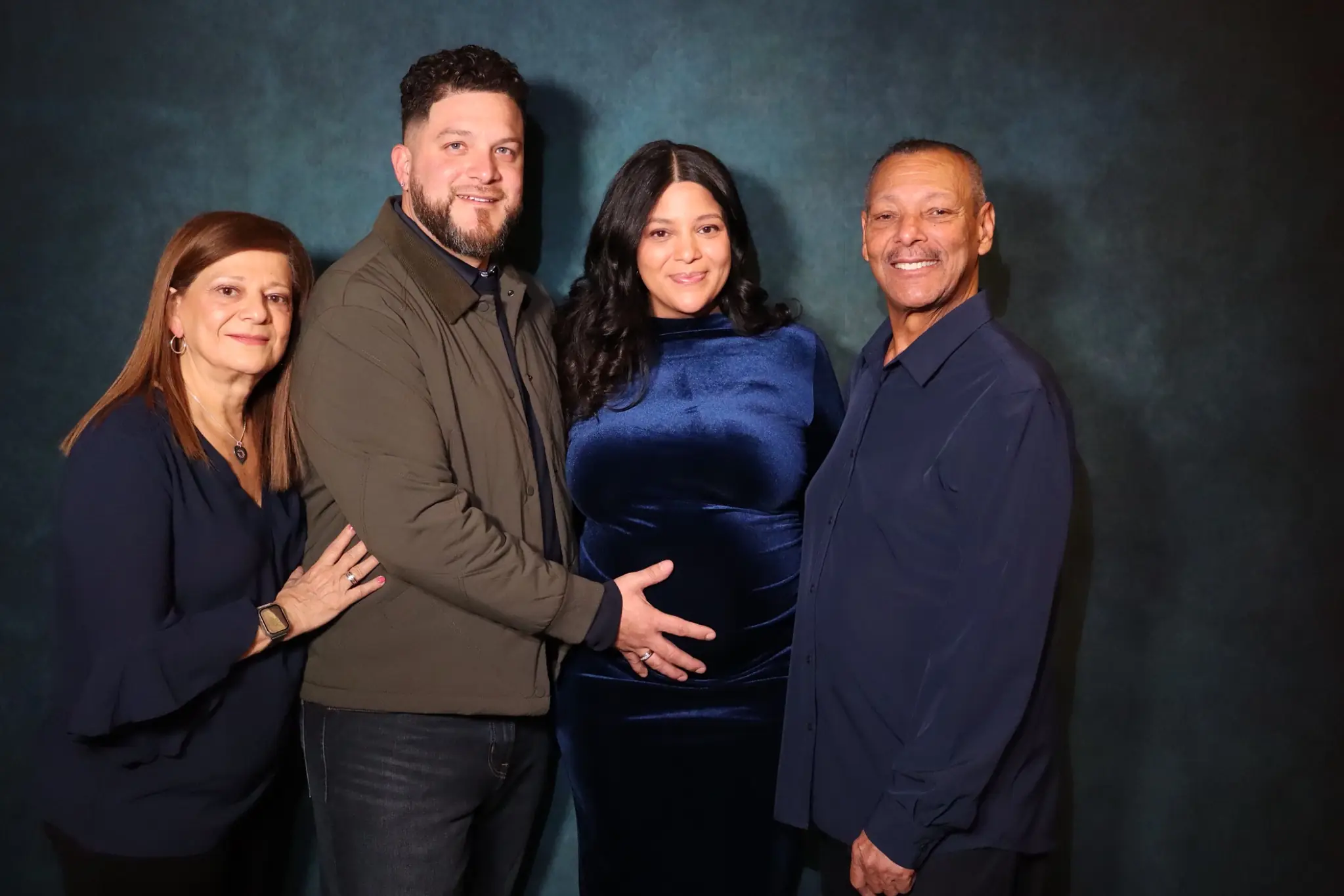 Warm multigenerational family photo from a baby shower by Images & Creations