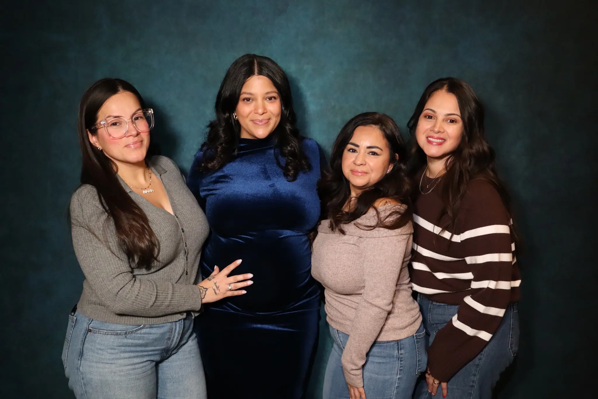 Family group photographed with studio-style booth lighting by Images & Creations