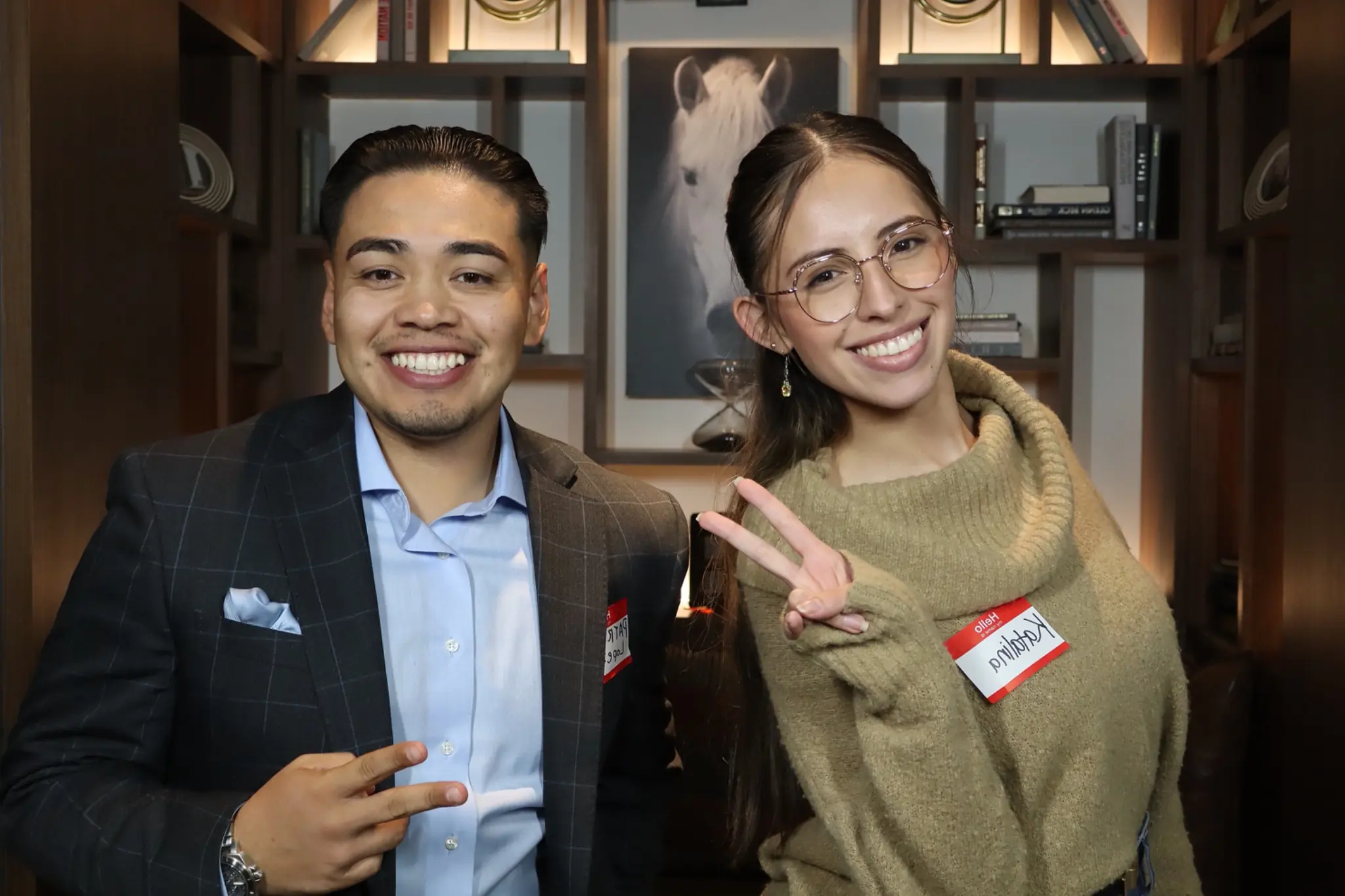 Guests posing together during a corporate networking mixer by Images & Creations